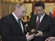 美媒：中俄日首脑互动 网民热议普京推销国产手机